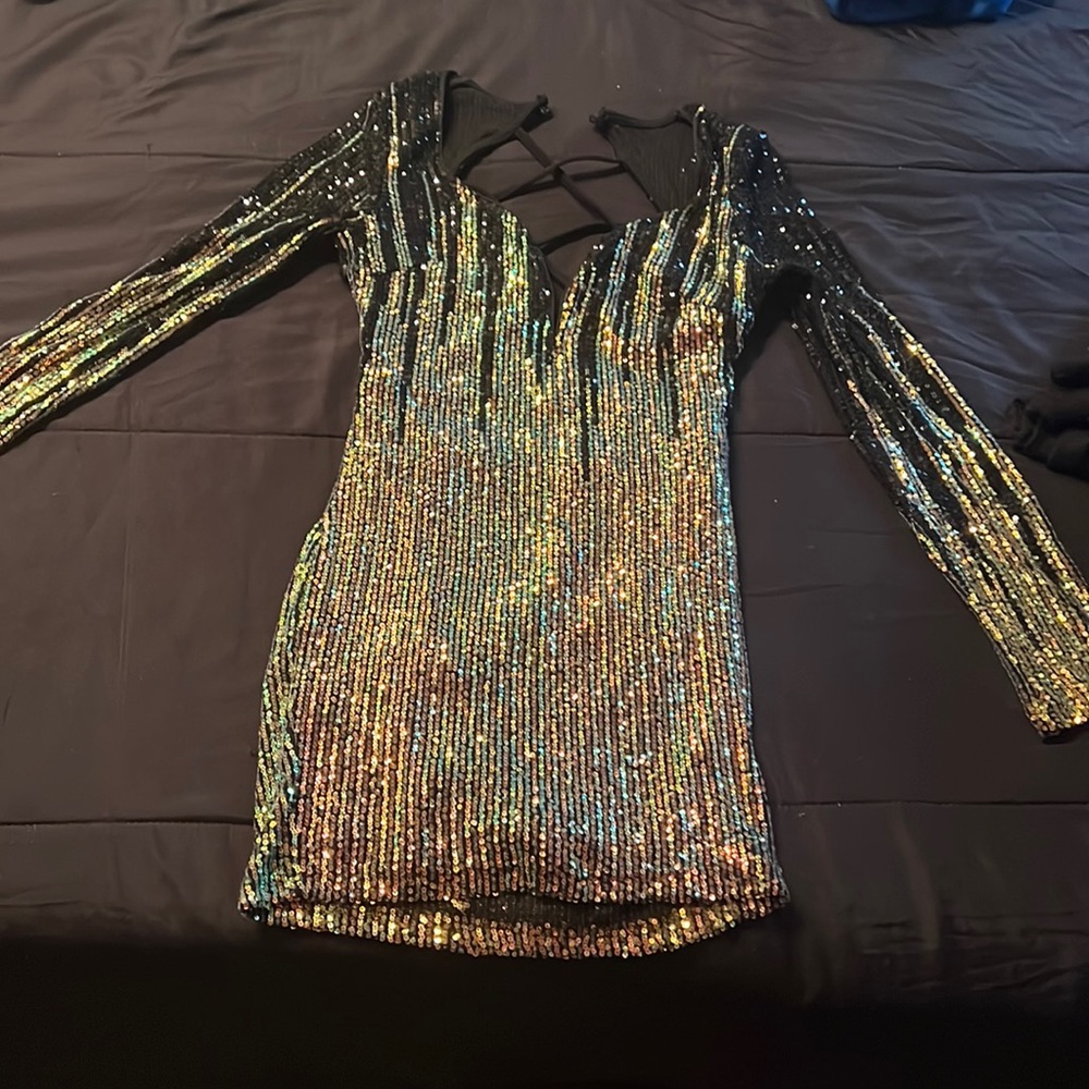 This is a min sequin dress with a criss cross back..this dress hugs your curves